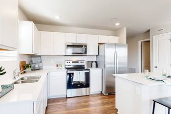 Fully equipped gourmet kitchens with quartz countertops